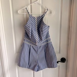 Light blue romper with white stripes and lace accents